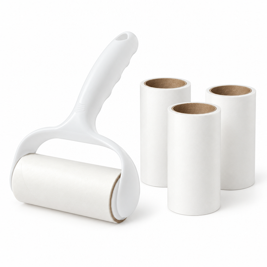 White lint roller with one installed roll and three spare rolls