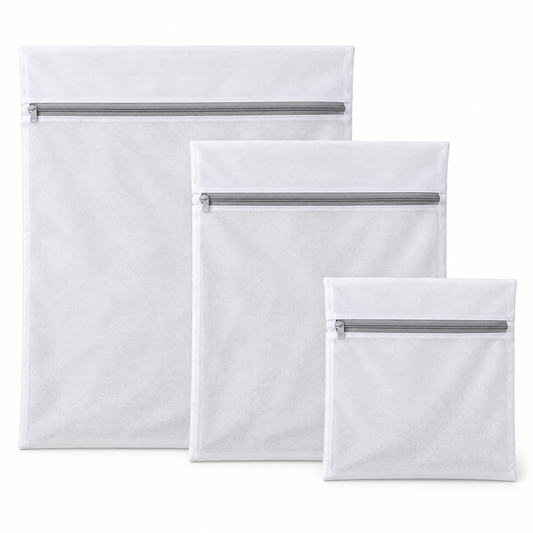 Three white mesh laundry bags in large, medium and small sizes